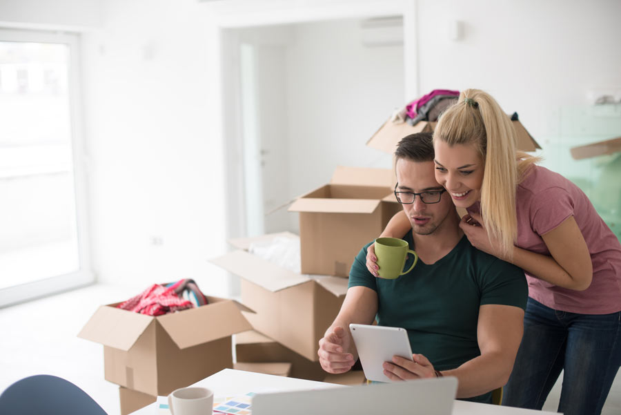 couple-searching-internet-for-home-builder