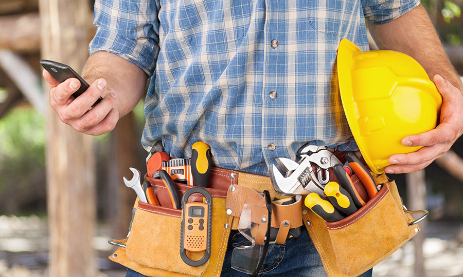 home-repair-service-man-holding-cell-phone-geofencing